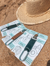 Load image into Gallery viewer, three variations of hat clips on the beach
