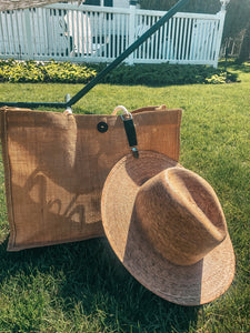 hat on lawn attached to bag with hat clip