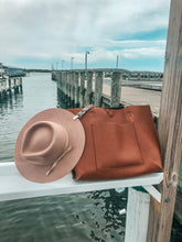 Load image into Gallery viewer, wool hat attached to bag with leather Kemi Clip
