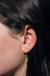 serpent earrings on models ear