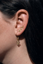 Load image into Gallery viewer, serpent huggie earrings on model
