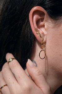 snake earrings shown on model
