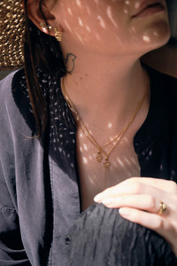 serpent necklaces on model