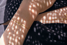 Load image into Gallery viewer, Serpent bracelet shown in shadows on model
