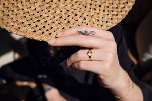 Serpent signet ring with whisker tattoo
