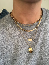 Load image into Gallery viewer, Yantra necklace layered with other gold necklaces

